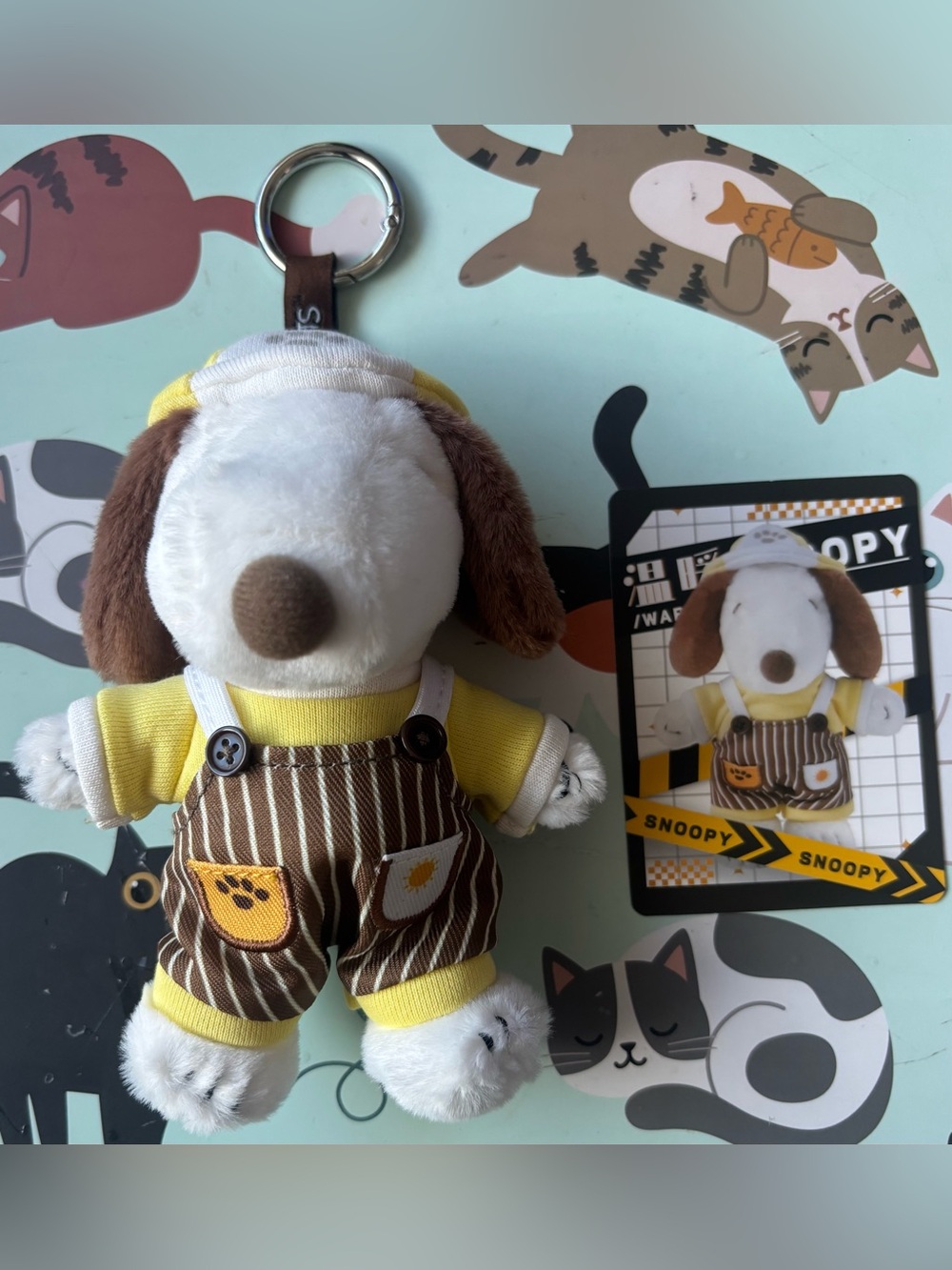 This Youmai x Peanuts Snoopy Mood Outfits Series plush keychain